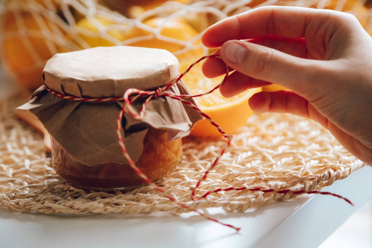 Close-up of a Woman Touching a Thread Attached to a Jar